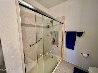 Beautifully decorated and fully furnished second-floor end unit on Sea Trail Golf Resort in North Carolina - for sale on GolfHomes.com, golf home, golf lot