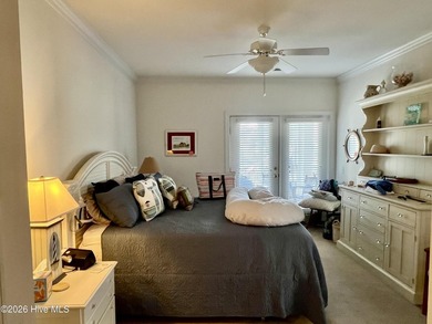 Beautifully decorated and fully furnished second-floor end unit on Sea Trail Golf Resort in North Carolina - for sale on GolfHomes.com, golf home, golf lot