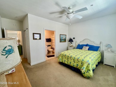 Beautifully decorated and fully furnished second-floor end unit on Sea Trail Golf Resort in North Carolina - for sale on GolfHomes.com, golf home, golf lot