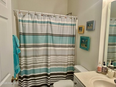 Beautifully decorated and fully furnished second-floor end unit on Sea Trail Golf Resort in North Carolina - for sale on GolfHomes.com, golf home, golf lot