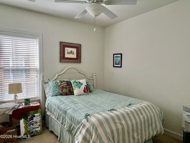 Beautifully decorated and fully furnished second-floor end unit on Sea Trail Golf Resort in North Carolina - for sale on GolfHomes.com, golf home, golf lot