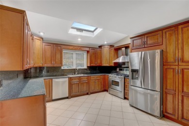 Welcome to this timeless 5-bedroom, 2.5-bath colonial brimming on Middle Bay Country Club in New York - for sale on GolfHomes.com, golf home, golf lot
