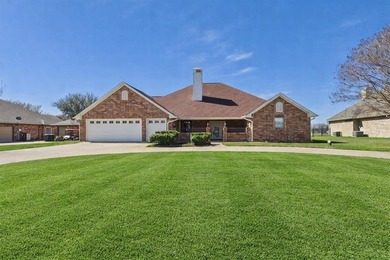 This exceptionally-updated 3 bedroom, 3 bathroom brick home in on Cedar Creek Country Club in Texas - for sale on GolfHomes.com, golf home, golf lot