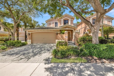 Spacious Coach Home with Golf Course Views in Weston Hills on Weston Hills Country Club in Florida - for sale on GolfHomes.com, golf home, golf lot