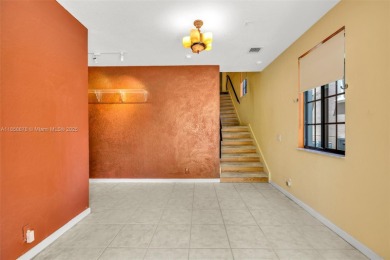 Spacious Coach Home with Golf Course Views in Weston Hills on Weston Hills Country Club in Florida - for sale on GolfHomes.com, golf home, golf lot