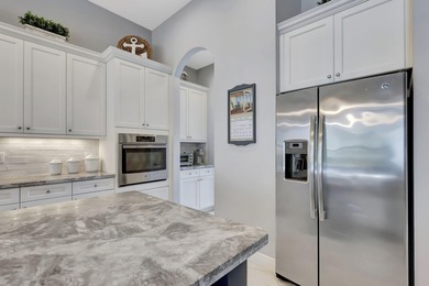 Experience refined living in this beautifully upgraded PGA on PGA Golf Club in PGA Village in Florida - for sale on GolfHomes.com, golf home, golf lot