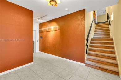 Spacious Coach Home with Golf Course Views in Weston Hills on Weston Hills Country Club in Florida - for sale on GolfHomes.com, golf home, golf lot