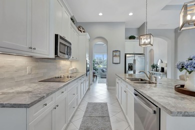 Experience refined living in this beautifully upgraded PGA on PGA Golf Club in PGA Village in Florida - for sale on GolfHomes.com, golf home, golf lot