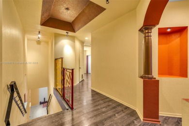 Spacious Coach Home with Golf Course Views in Weston Hills on Weston Hills Country Club in Florida - for sale on GolfHomes.com, golf home, golf lot