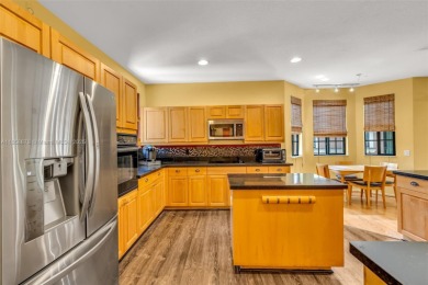 Spacious Coach Home with Golf Course Views in Weston Hills on Weston Hills Country Club in Florida - for sale on GolfHomes.com, golf home, golf lot