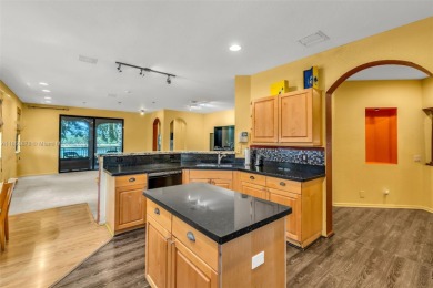 Spacious Coach Home with Golf Course Views in Weston Hills on Weston Hills Country Club in Florida - for sale on GolfHomes.com, golf home, golf lot