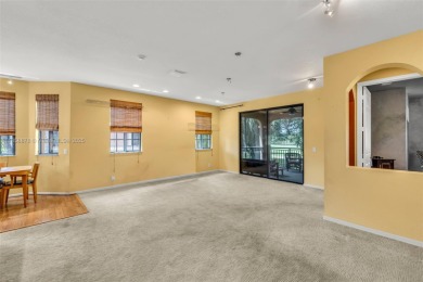 Spacious Coach Home with Golf Course Views in Weston Hills on Weston Hills Country Club in Florida - for sale on GolfHomes.com, golf home, golf lot