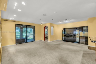 Spacious Coach Home with Golf Course Views in Weston Hills on Weston Hills Country Club in Florida - for sale on GolfHomes.com, golf home, golf lot