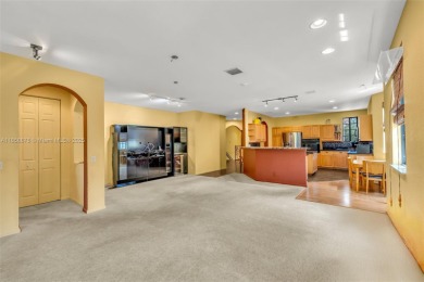 Spacious Coach Home with Golf Course Views in Weston Hills on Weston Hills Country Club in Florida - for sale on GolfHomes.com, golf home, golf lot