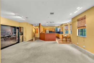 Spacious Coach Home with Golf Course Views in Weston Hills on Weston Hills Country Club in Florida - for sale on GolfHomes.com, golf home, golf lot