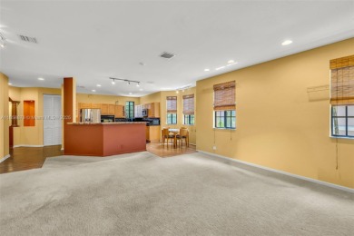 Spacious Coach Home with Golf Course Views in Weston Hills on Weston Hills Country Club in Florida - for sale on GolfHomes.com, golf home, golf lot