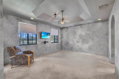Spacious Coach Home with Golf Course Views in Weston Hills on Weston Hills Country Club in Florida - for sale on GolfHomes.com, golf home, golf lot