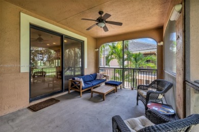 Spacious Coach Home with Golf Course Views in Weston Hills on Weston Hills Country Club in Florida - for sale on GolfHomes.com, golf home, golf lot
