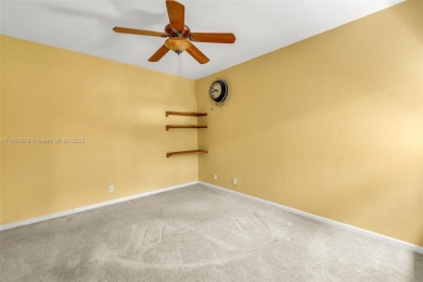 Spacious Coach Home with Golf Course Views in Weston Hills on Weston Hills Country Club in Florida - for sale on GolfHomes.com, golf home, golf lot