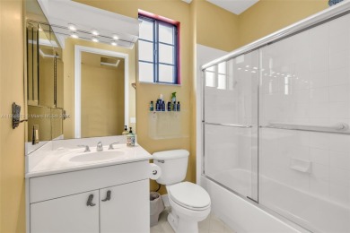 Spacious Coach Home with Golf Course Views in Weston Hills on Weston Hills Country Club in Florida - for sale on GolfHomes.com, golf home, golf lot