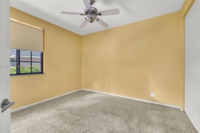 Spacious Coach Home with Golf Course Views in Weston Hills on Weston Hills Country Club in Florida - for sale on GolfHomes.com, golf home, golf lot