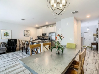 Discover this stunning 4-bedroom, 3-bathroom townhouse in the on The Oasis Club at Champions Gate in Florida - for sale on GolfHomes.com, golf home, golf lot