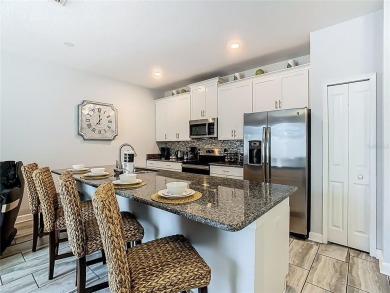 Discover this stunning 4-bedroom, 3-bathroom townhouse in the on The Oasis Club at Champions Gate in Florida - for sale on GolfHomes.com, golf home, golf lot