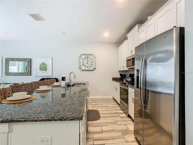 Discover this stunning 4-bedroom, 3-bathroom townhouse in the on The Oasis Club at Champions Gate in Florida - for sale on GolfHomes.com, golf home, golf lot