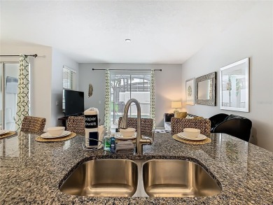 Discover this stunning 4-bedroom, 3-bathroom townhouse in the on The Oasis Club at Champions Gate in Florida - for sale on GolfHomes.com, golf home, golf lot
