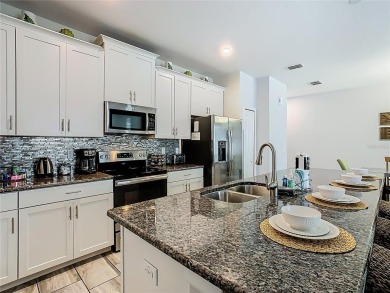 Discover this stunning 4-bedroom, 3-bathroom townhouse in the on The Oasis Club at Champions Gate in Florida - for sale on GolfHomes.com, golf home, golf lot