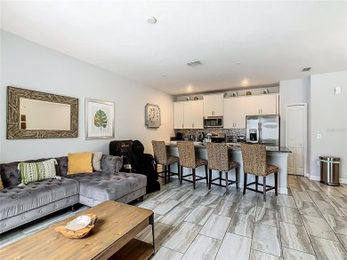 Discover this stunning 4-bedroom, 3-bathroom townhouse in the on The Oasis Club at Champions Gate in Florida - for sale on GolfHomes.com, golf home, golf lot