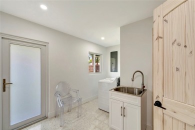Modern charm meets timeless elegance in this fully renovated 3/2 on Vero Beach Country Club in Florida - for sale on GolfHomes.com, golf home, golf lot