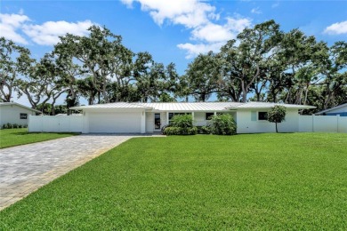 Modern charm meets timeless elegance in this fully renovated 3/2 on Vero Beach Country Club in Florida - for sale on GolfHomes.com, golf home, golf lot
