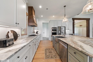 Experience panoramic views of Lake Oconee from this stunning on The Golf Club at Cuscowilla in Georgia - for sale on GolfHomes.com, golf home, golf lot