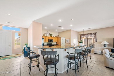 This beautifully maintained residence, located in a desirable on Trilogy Golf Club At Power Ranch in Arizona - for sale on GolfHomes.com, golf home, golf lot