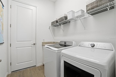 Live the ultimate resort lifestyle in this TURNKEY pool home on Heritage Landing Golf  in Florida - for sale on GolfHomes.com, golf home, golf lot