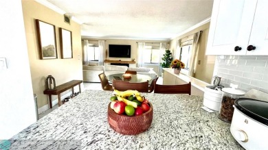 Experience breathtaking views from this spacious corner unit at on Jacaranda Golf Club in Florida - for sale on GolfHomes.com, golf home, golf lot