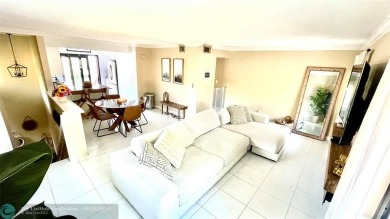 Experience breathtaking views from this spacious corner unit at on Jacaranda Golf Club in Florida - for sale on GolfHomes.com, golf home, golf lot