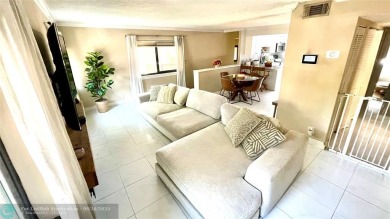 Experience breathtaking views from this spacious corner unit at on Jacaranda Golf Club in Florida - for sale on GolfHomes.com, golf home, golf lot