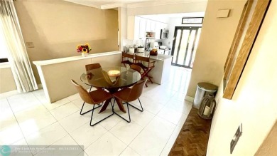 Experience breathtaking views from this spacious corner unit at on Jacaranda Golf Club in Florida - for sale on GolfHomes.com, golf home, golf lot