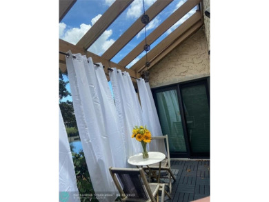 Experience breathtaking views from this spacious corner unit at on Jacaranda Golf Club in Florida - for sale on GolfHomes.com, golf home, golf lot