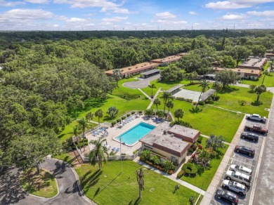 Turn-key 2 BR 2 BA condo in Pinehurst Village. 55+ one-story on The Dunedin Country Club in Florida - for sale on GolfHomes.com, golf home, golf lot
