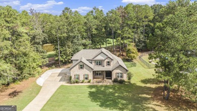 Discover this stunning Craftsman-style home featuring 4 bedrooms on Canongate At Georgia National Golf Club in Georgia - for sale on GolfHomes.com, golf home, golf lot