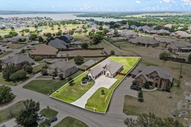 Welcome to this immaculate former model home, nestled on a on The Golf Club at Resort Eagle Mountain Lake in Texas - for sale on GolfHomes.com, golf home, golf lot