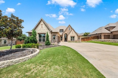 Welcome to this immaculate former model home, nestled on a on The Golf Club at Resort Eagle Mountain Lake in Texas - for sale on GolfHomes.com, golf home, golf lot