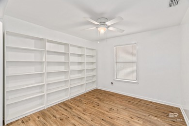 This charming 3 bed/2 bath Lake Forest cottage on a spacious on Lake Forest Yacht and Country Club in Alabama - for sale on GolfHomes.com, golf home, golf lot