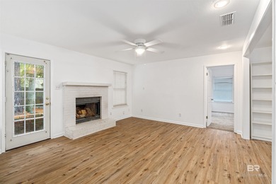 This charming 3 bed/2 bath Lake Forest cottage on a spacious on Lake Forest Yacht and Country Club in Alabama - for sale on GolfHomes.com, golf home, golf lot