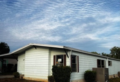 Welcome to your serene sanctuary nestled on an exterior lot of on Lake Henry Golf Club in Florida - for sale on GolfHomes.com, golf home, golf lot