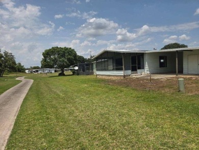 Welcome to your serene sanctuary nestled on an exterior lot of on Lake Henry Golf Club in Florida - for sale on GolfHomes.com, golf home, golf lot