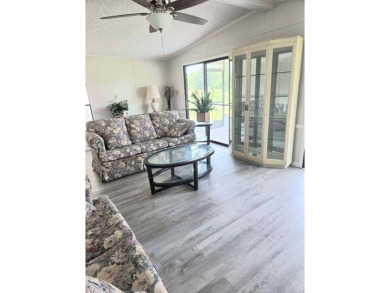 Welcome to your serene sanctuary nestled on an exterior lot of on Lake Henry Golf Club in Florida - for sale on GolfHomes.com, golf home, golf lot